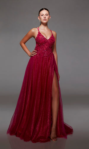 Fuchsia pink glitter tulle A-line prom dress: plunging V neckline, front slit, crisscross back straps, and train. A dazzling choice for an vibrant and stylish look.