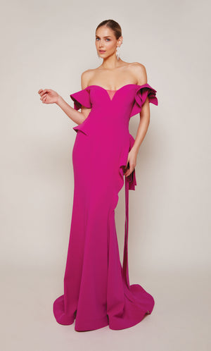 A chic, raspberry pink wedding guest dress boasting an off-the-shoulder neckline, rosette sleeves, and a sheath skirt with cascading ruffles. An excellent choice for a formal evening wedding.