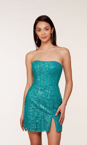 A short strapless corset dress with a sheer bodice adorned with an intricate lace overlay and a side slit. The dress was created in a refreshing teal-like color called lapis.